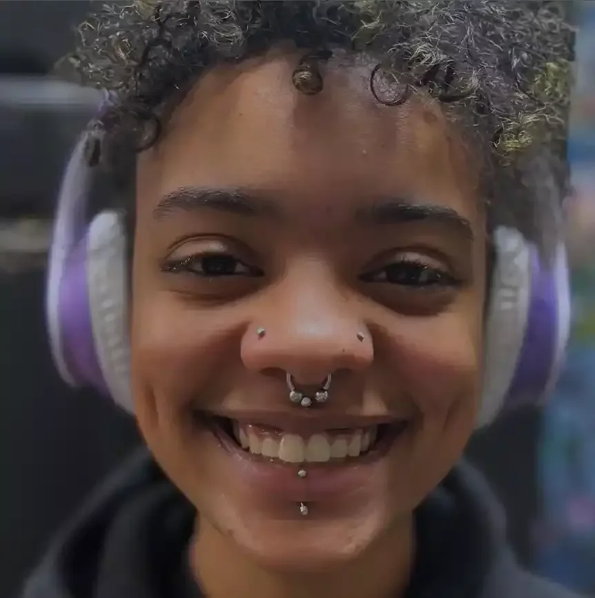 Fresh paired nostril piercings using titanium opal threadless ends and titanium threadless labret posts done by Amber Paje of James River Tattoo in Carrollton Virginia