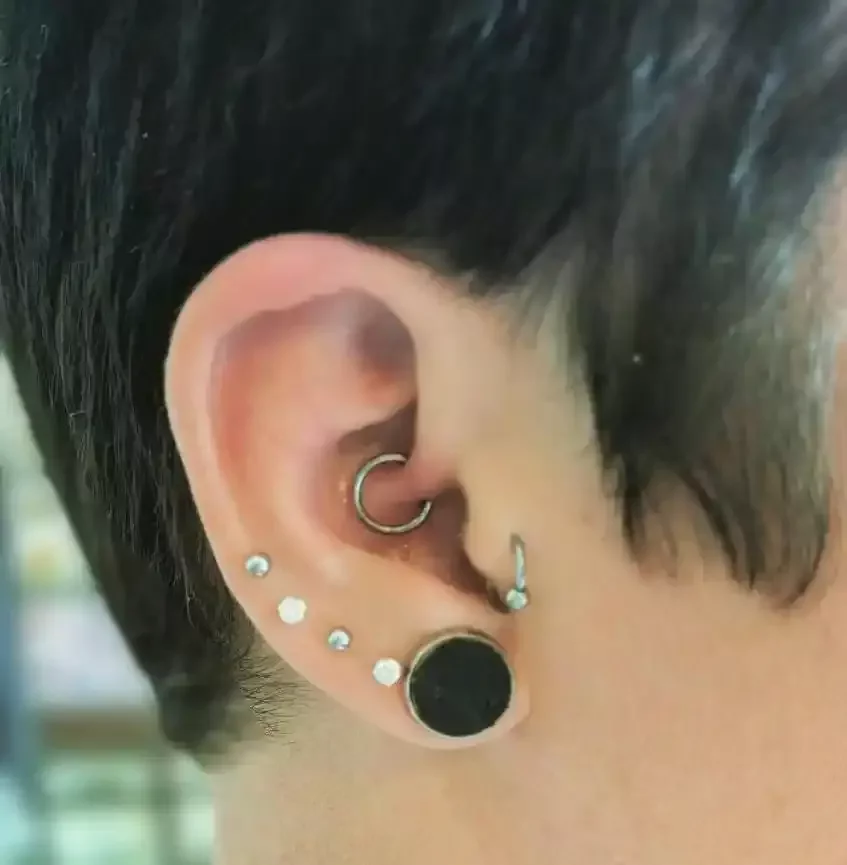 Fresh daith piercing using titanium clicker done by Amber Paje of James River Tattoo in Carrollton Virginia