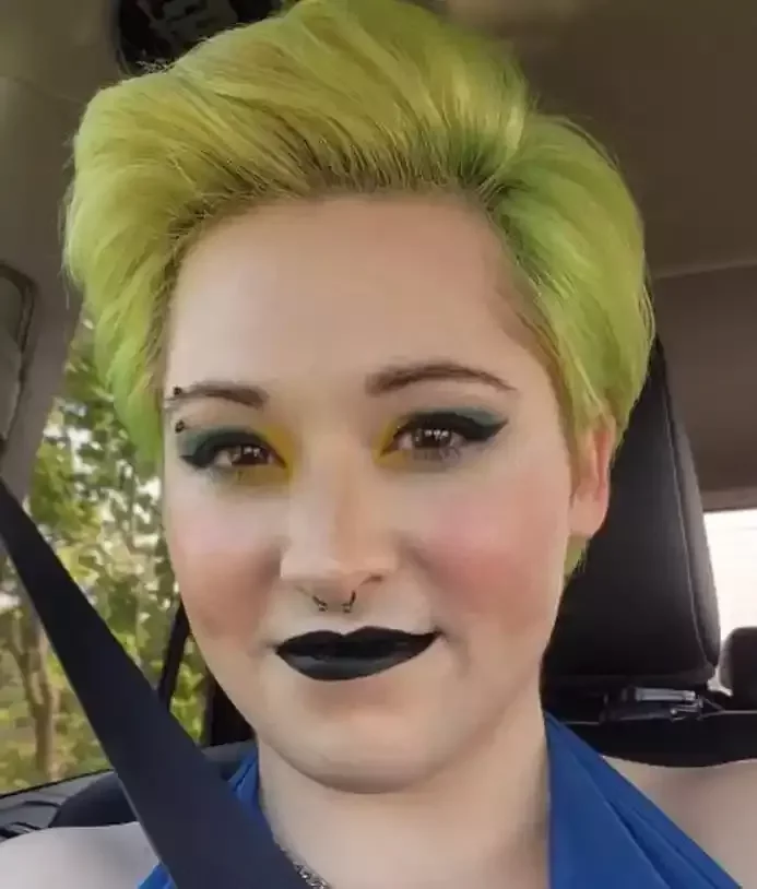 Healed septum piercing featuring a titanium black PVD internally threaded barbell done by Amber Paje of James River Tattoo in Carrollton Virginia