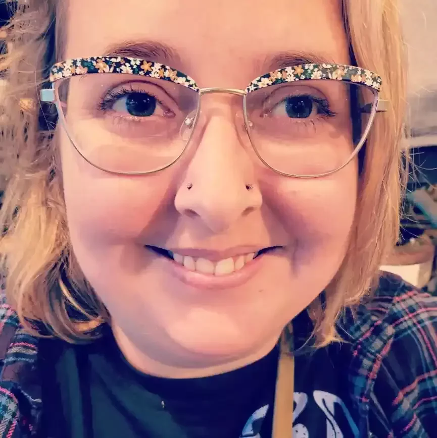 Fresh paired nostril piercings using threadless cubic zirconia ends on threadless titanium labret posts done by Amber Paje of James River Tattoo in Carrollton Virginia