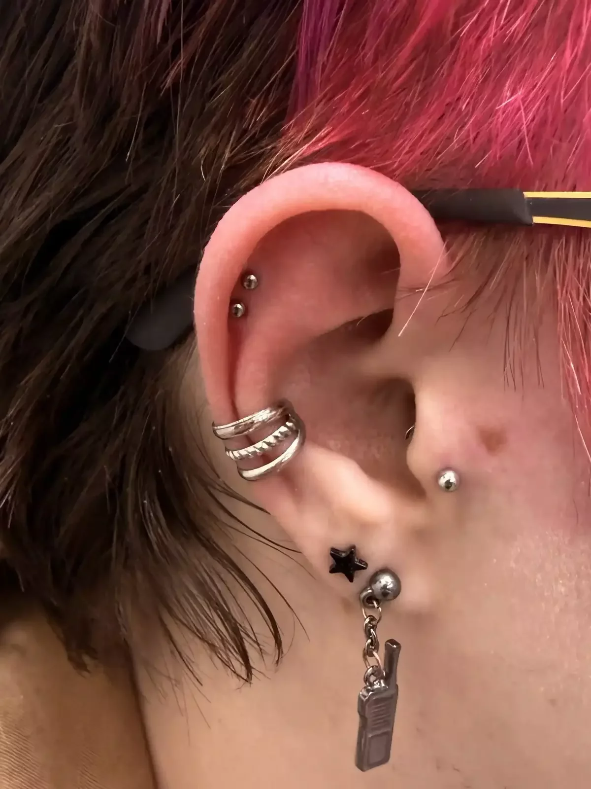 Fresh double helix piercing using titanium dome threadless ends and titanium threadless labret posts done by Amber Paje of James River Tattoo in Carrollton VA