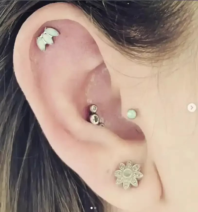 Titanium ear curation opal marquise end threadless white opal labret posts done by Amber Paje of James River Tattoo Carrollton VA